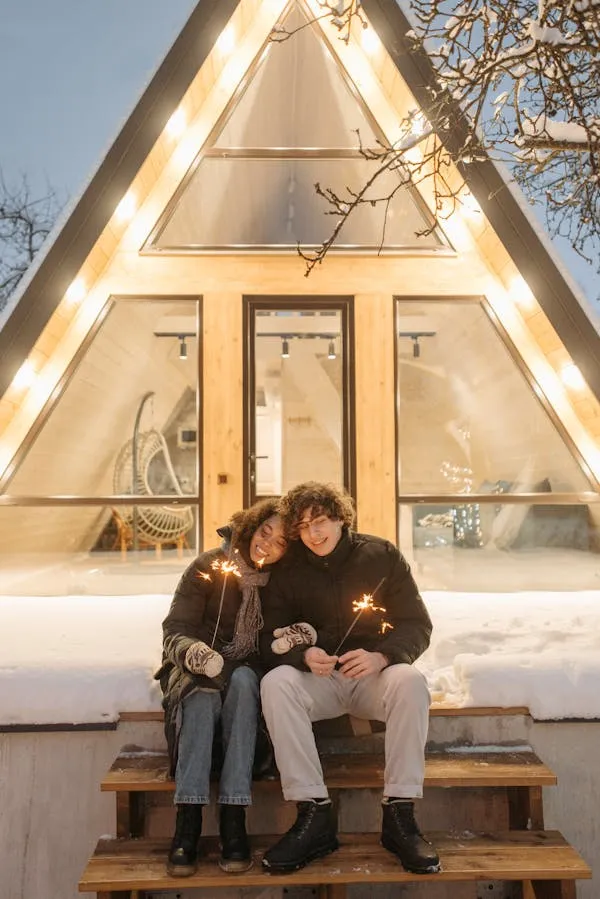 Cozy Couple Holding Sparkler at a Festive Celebration image