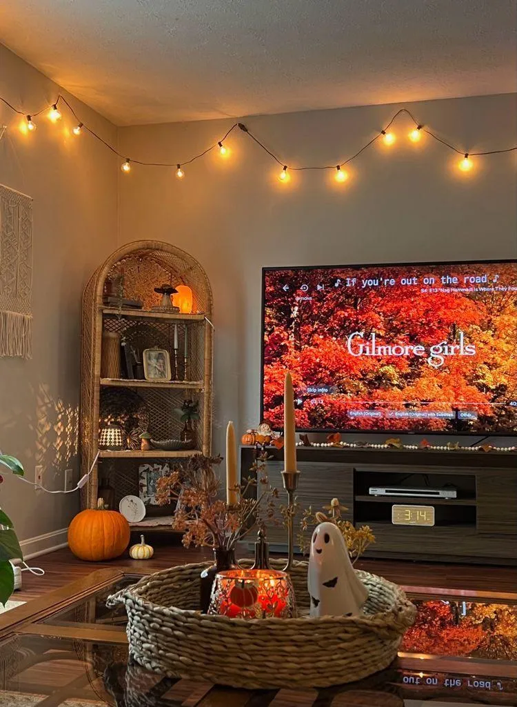 Cozy Living Room Setup with Tv and Seasonal Pumpkin Decor