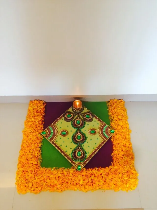 Creative corner orange square Athapookolam with bead design