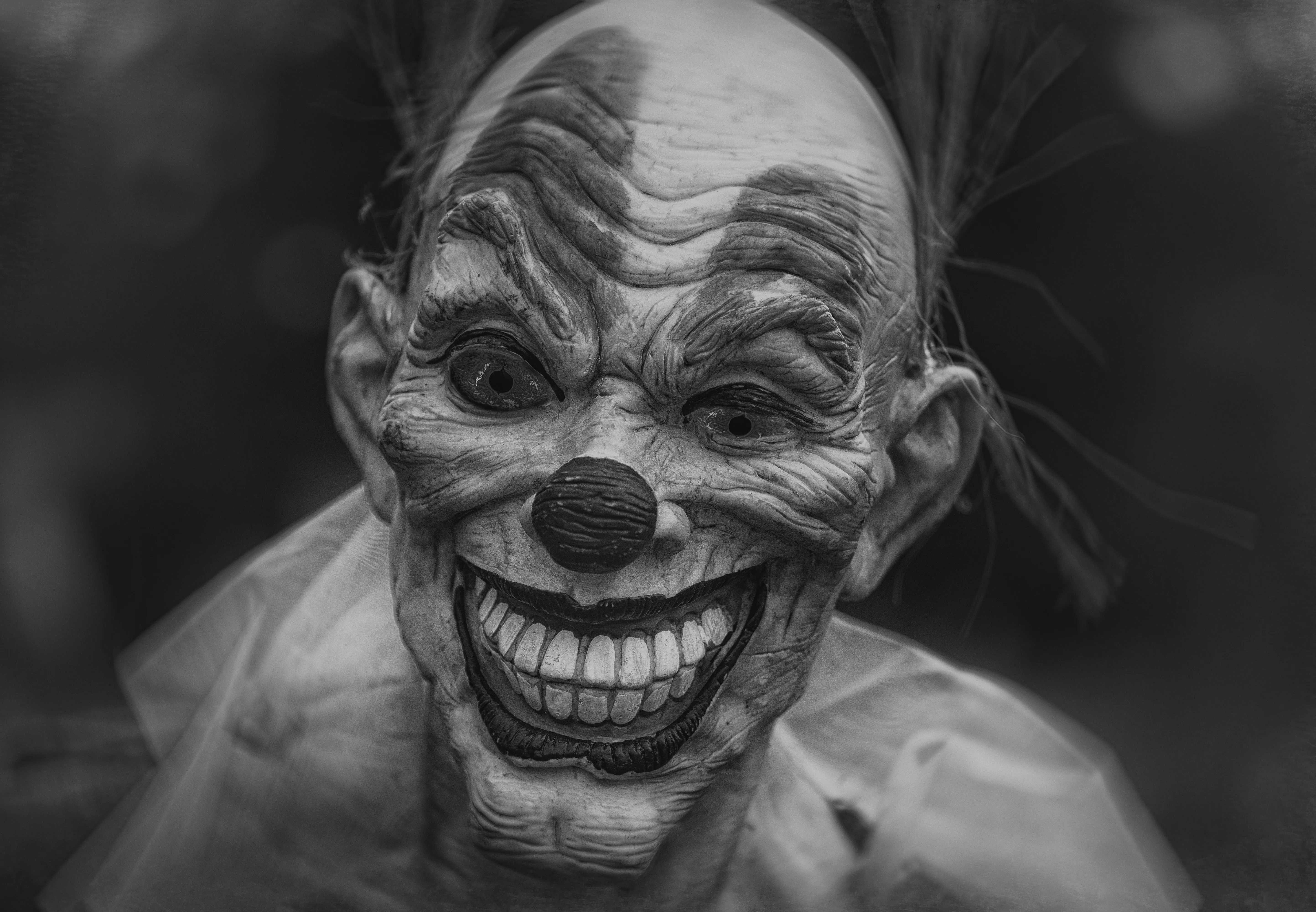 Creepy Clown Face Close up at Halloween Festival Wallpaper