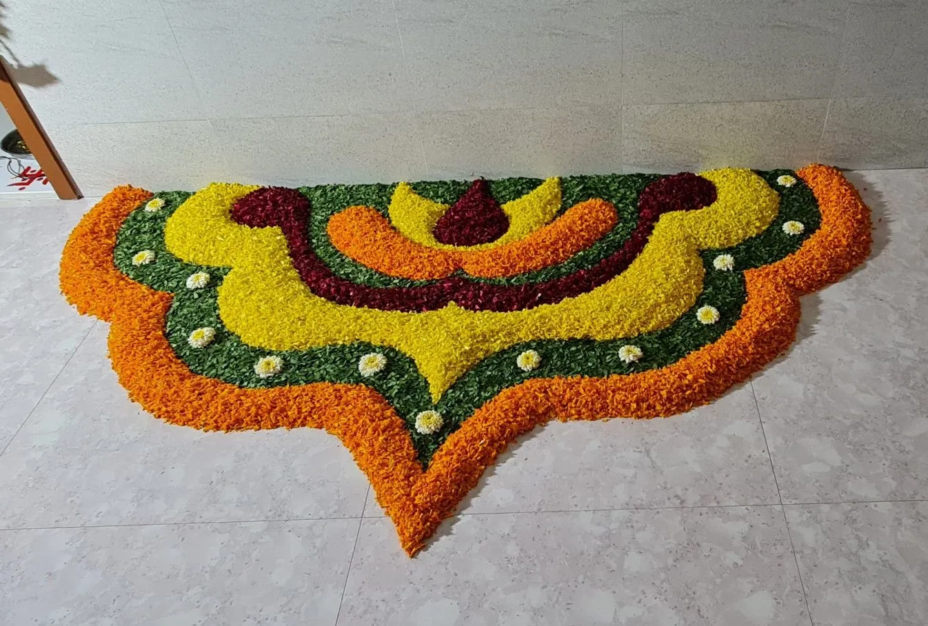 Crown shape Athapookolam with Multiple colours Wallpaper