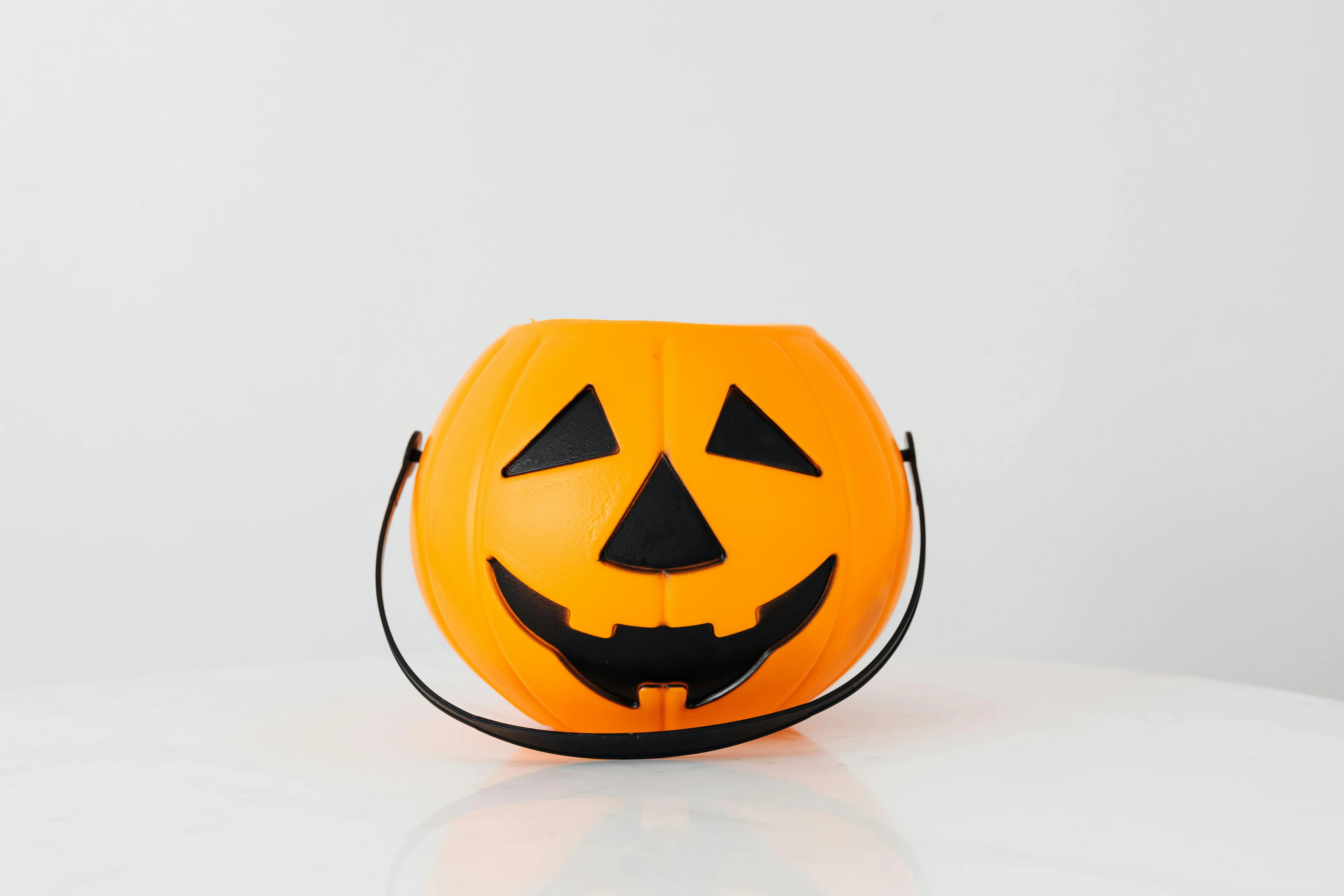 Cute Cartoon Style Plastic Pumpkin Bucket on White Background