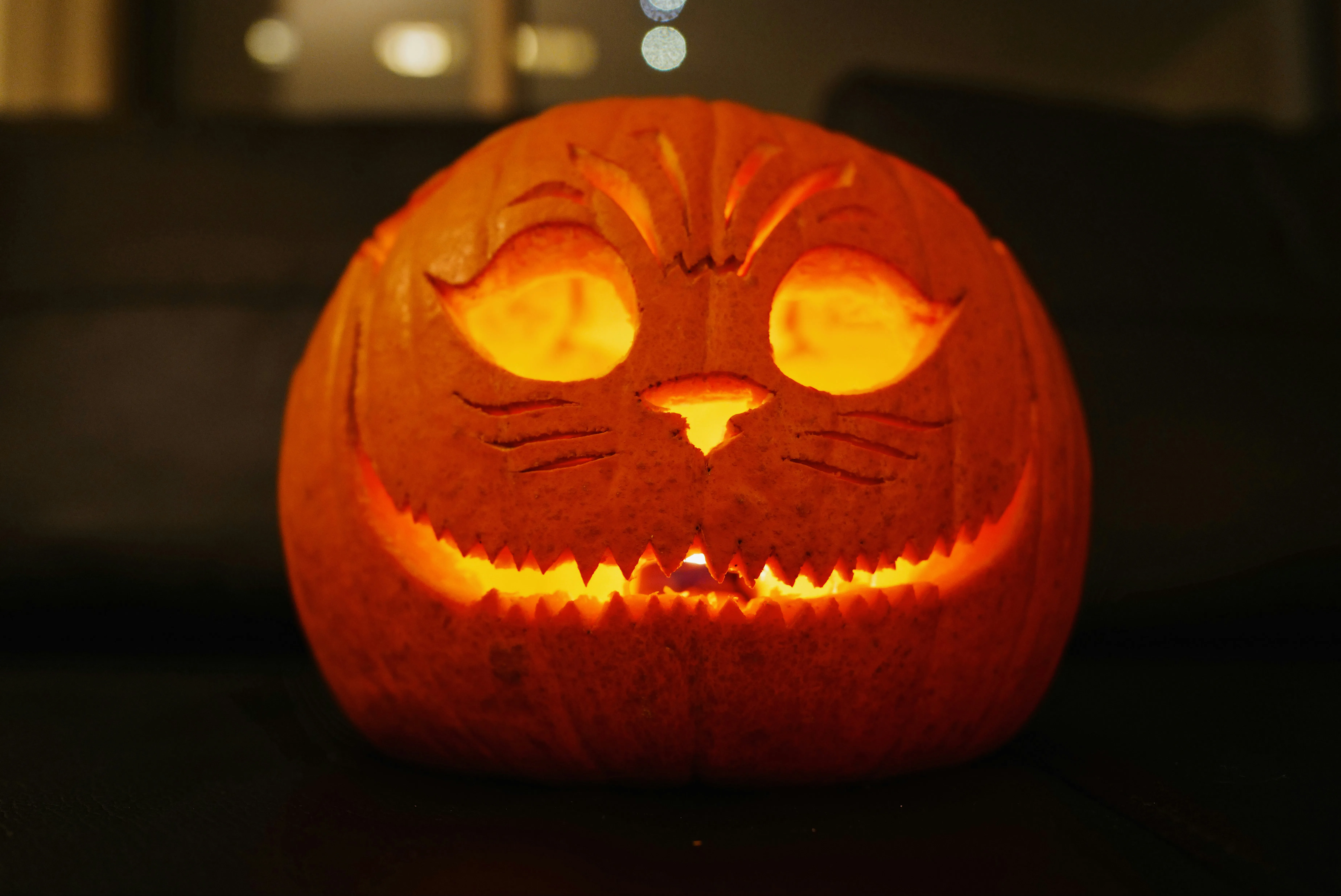 Cute Carved Pumpkin with Smiling Face and Warm Glow Image