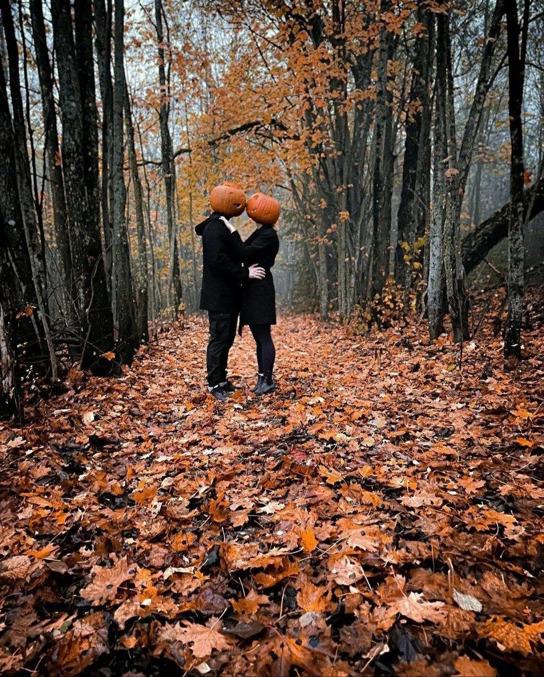 Dark Forest Scene with Couple in Creepy Pumpkin Mask