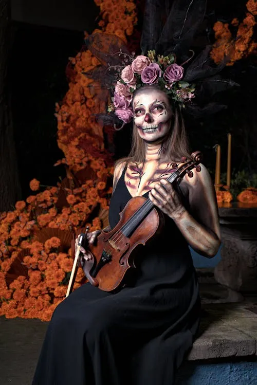 Dark Gothic Costume with Floral Headpiece holding Guitar