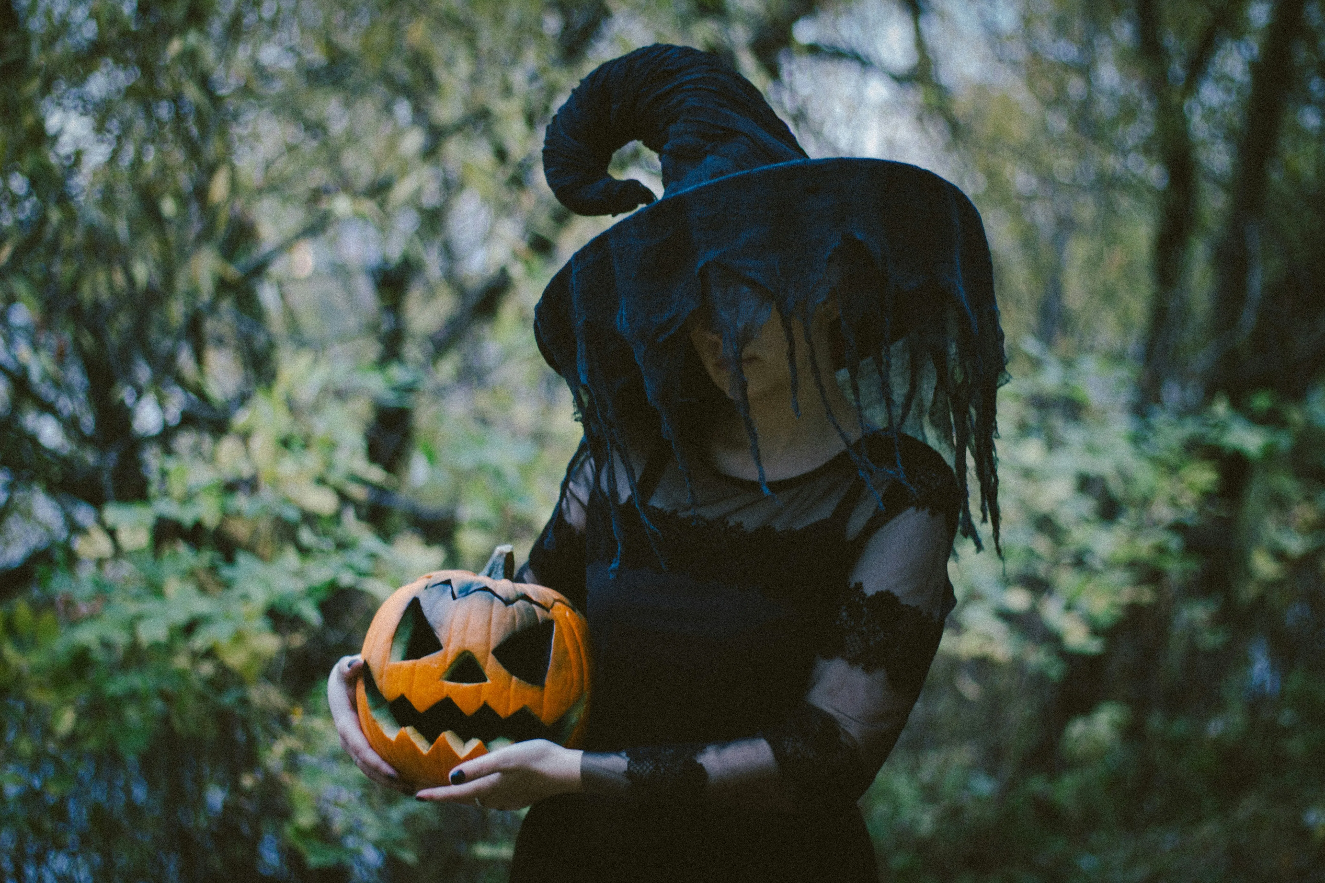 Dark Halloween Costume Girl Holding Pumpkin Lantern Image