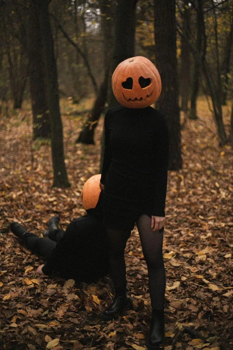 Dark Pumpkin Head Halloween Shoot in Moody Autumn Forest