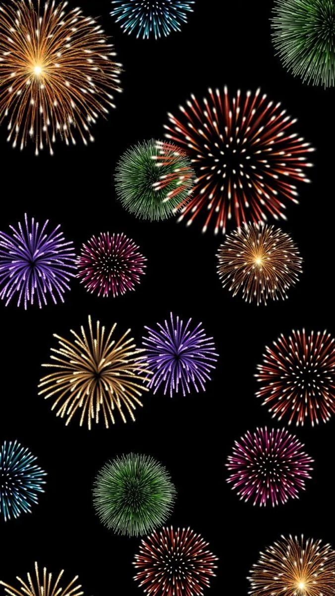 Dark sky filled with vibrant multicolored fireworks