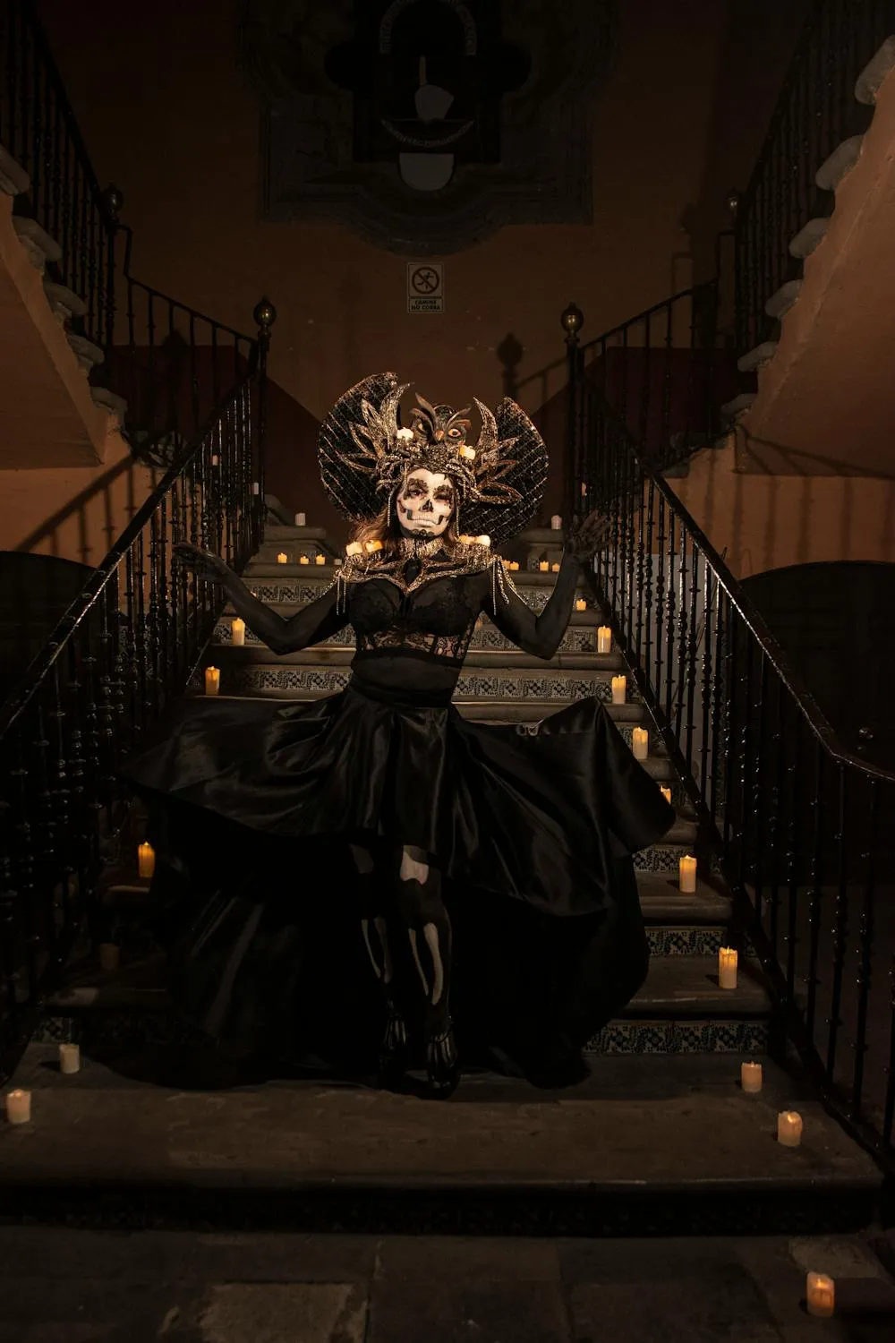 Dark Themed Halloween Costume Sitting on Staircase Wallpaper