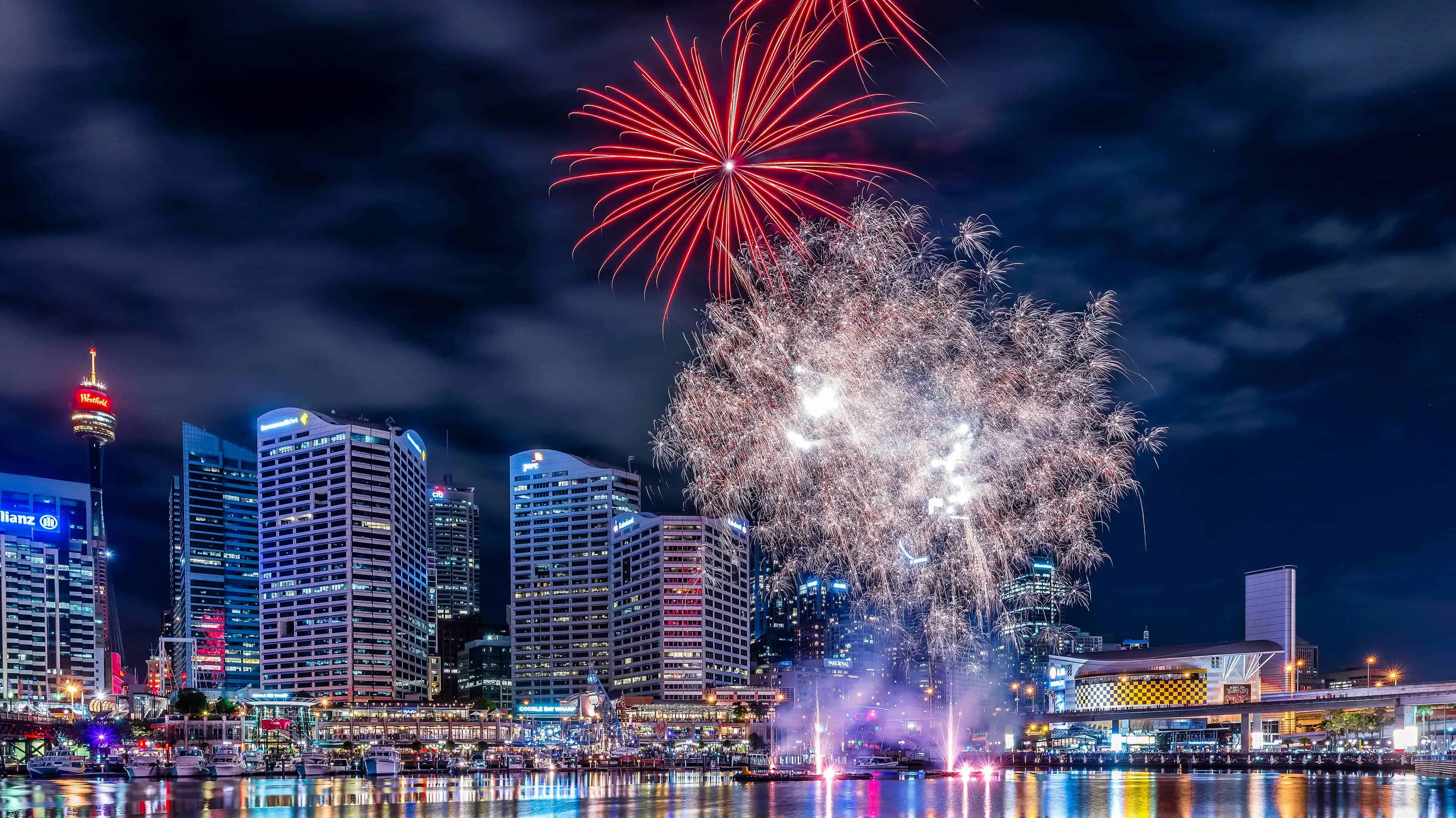 Dazzling cityscape with fireworks lighting up the sky HD