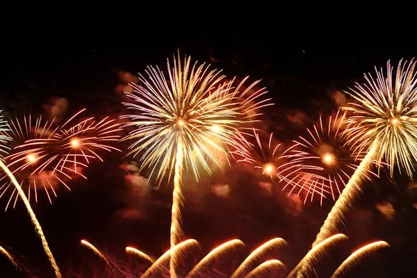 Detailed shot of golden fireworks radiating with precision