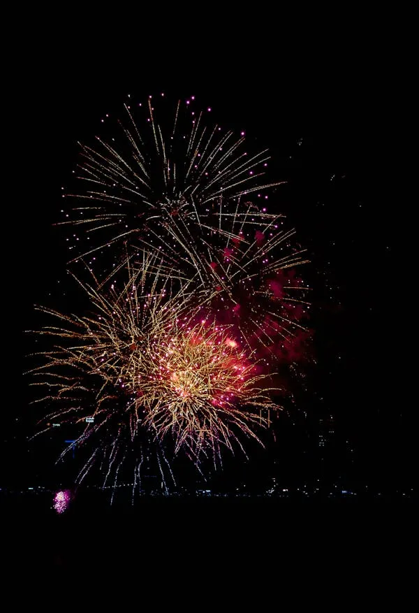 Dramatic Fireworks Show with Bright Red and Yellow Explosions