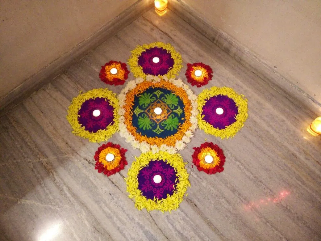 Elegant floral pookolam with petals and glowing lights image