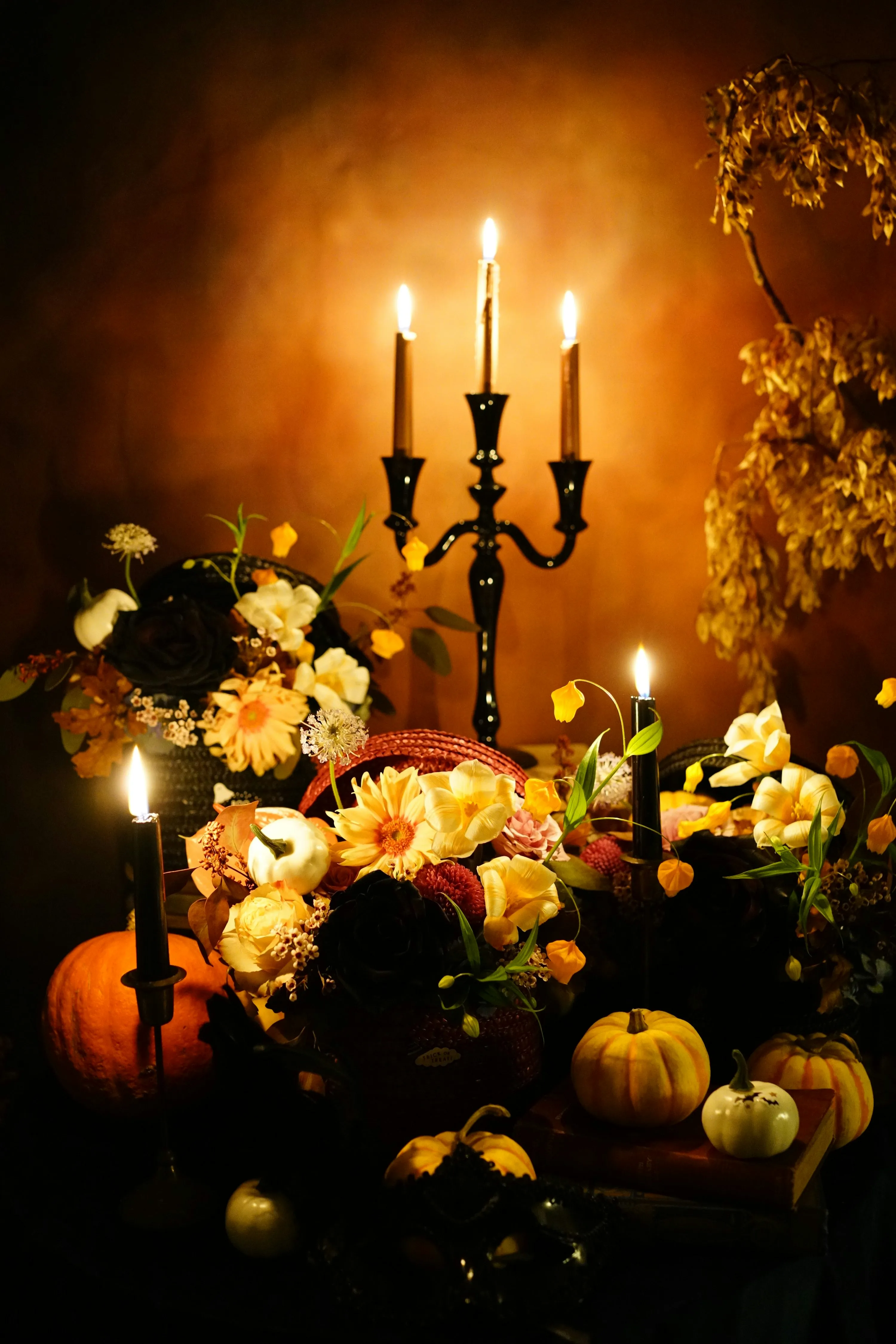 Elegant Halloween Floral Arrangement with Pumpkins Image
