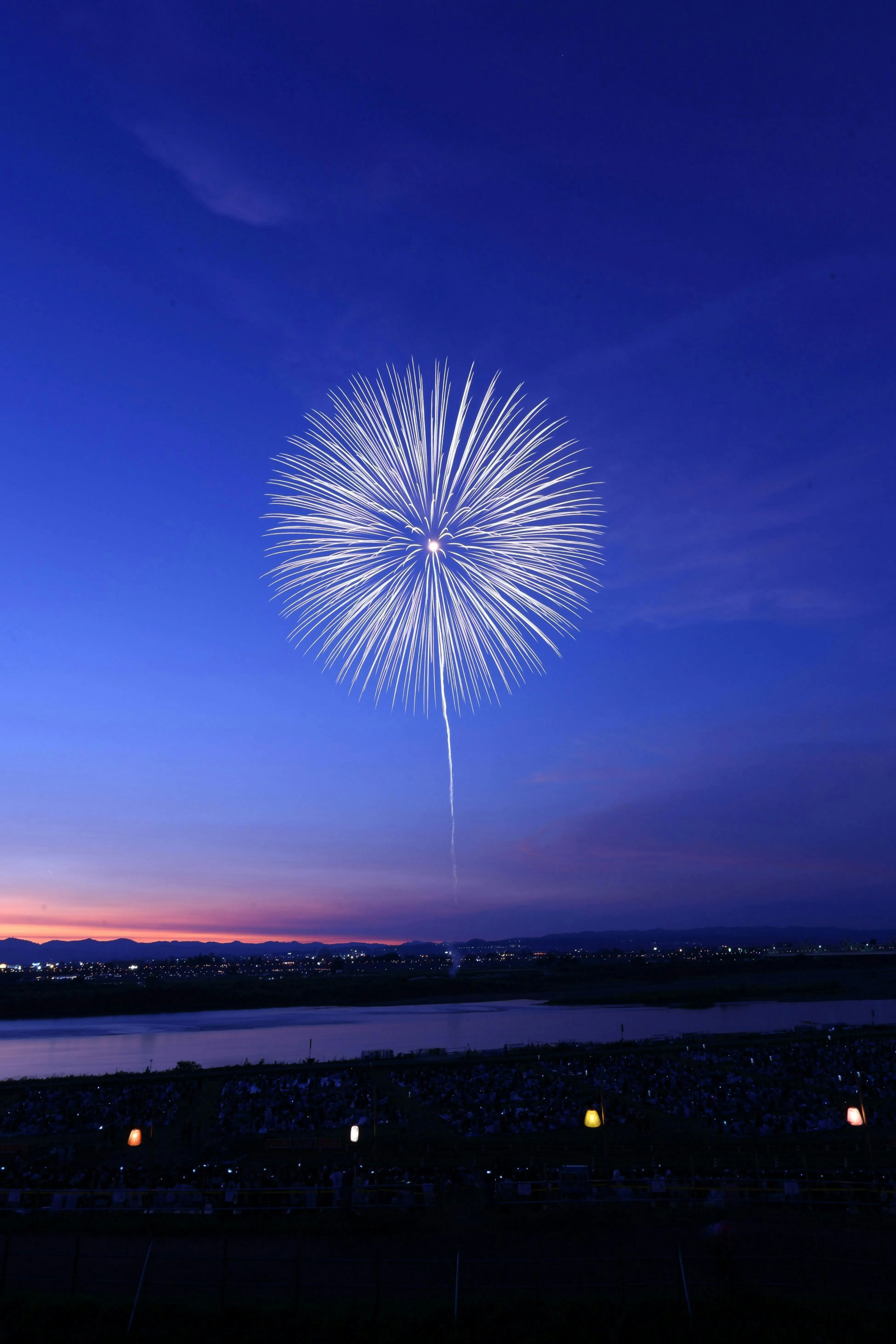 Elegant long exposure fireworks with a glowing sphere