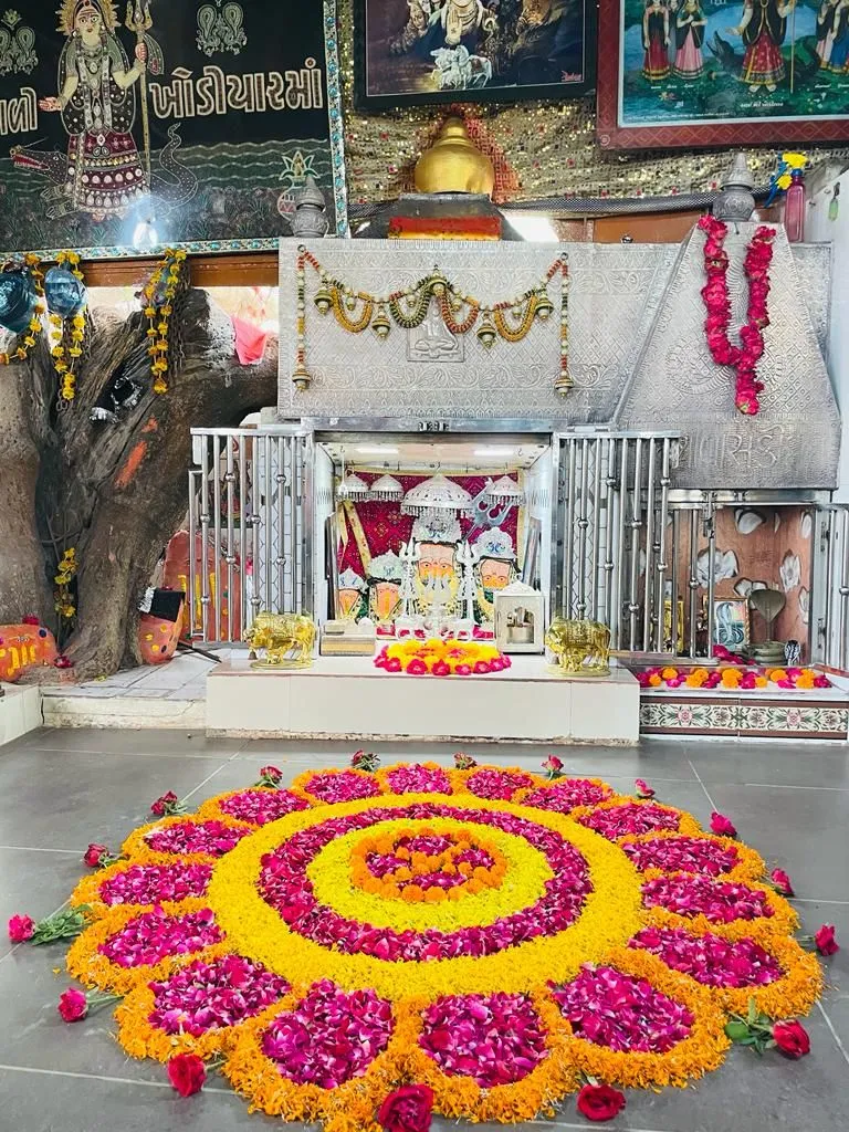 Elegant Temple pookolam with marigolds and rose petal image