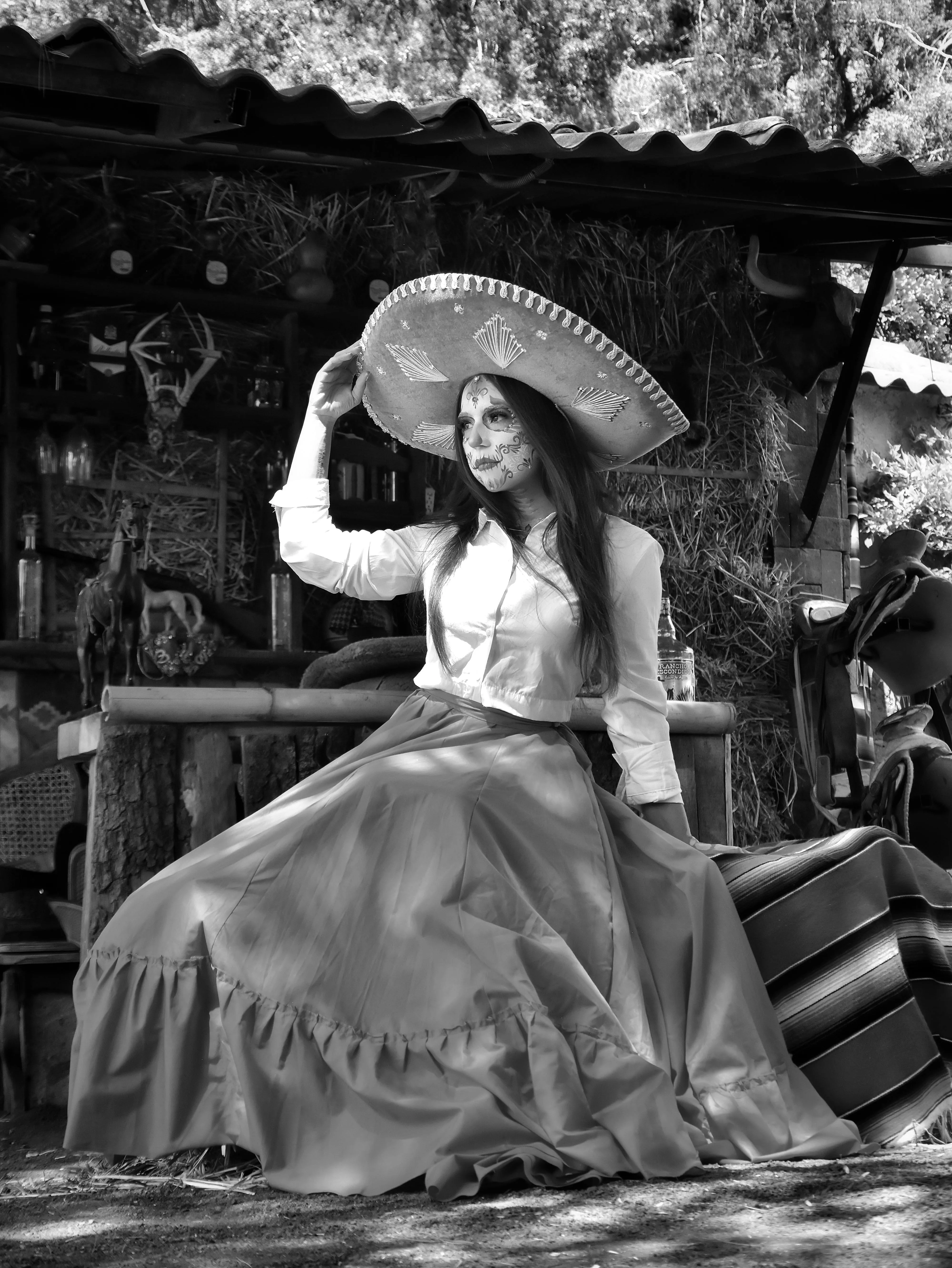 Elegant Woman in Day of the Dead Outfit with Fan Wallpaper