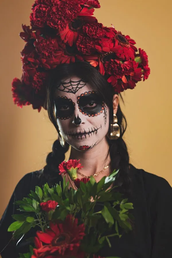 Elegant Woman with Day of the Dead Makeup and Flowers