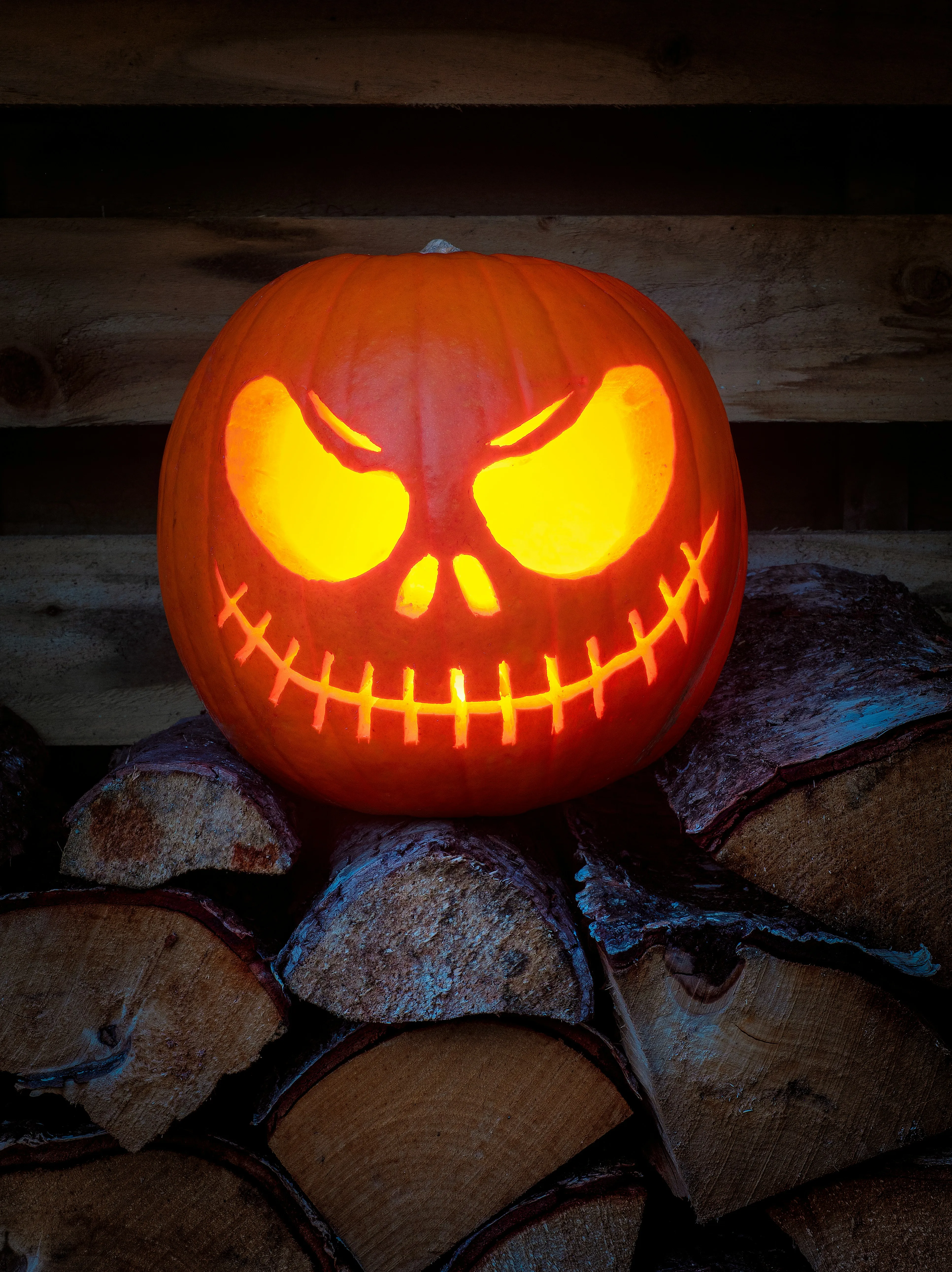Evil Grinning Carved Pumpkin Jack O Lantern at Night Image