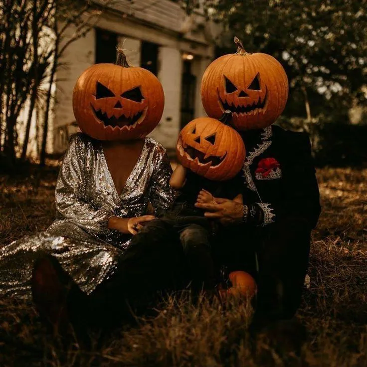 Family in pumpkin head costumes capturing Halloween joy