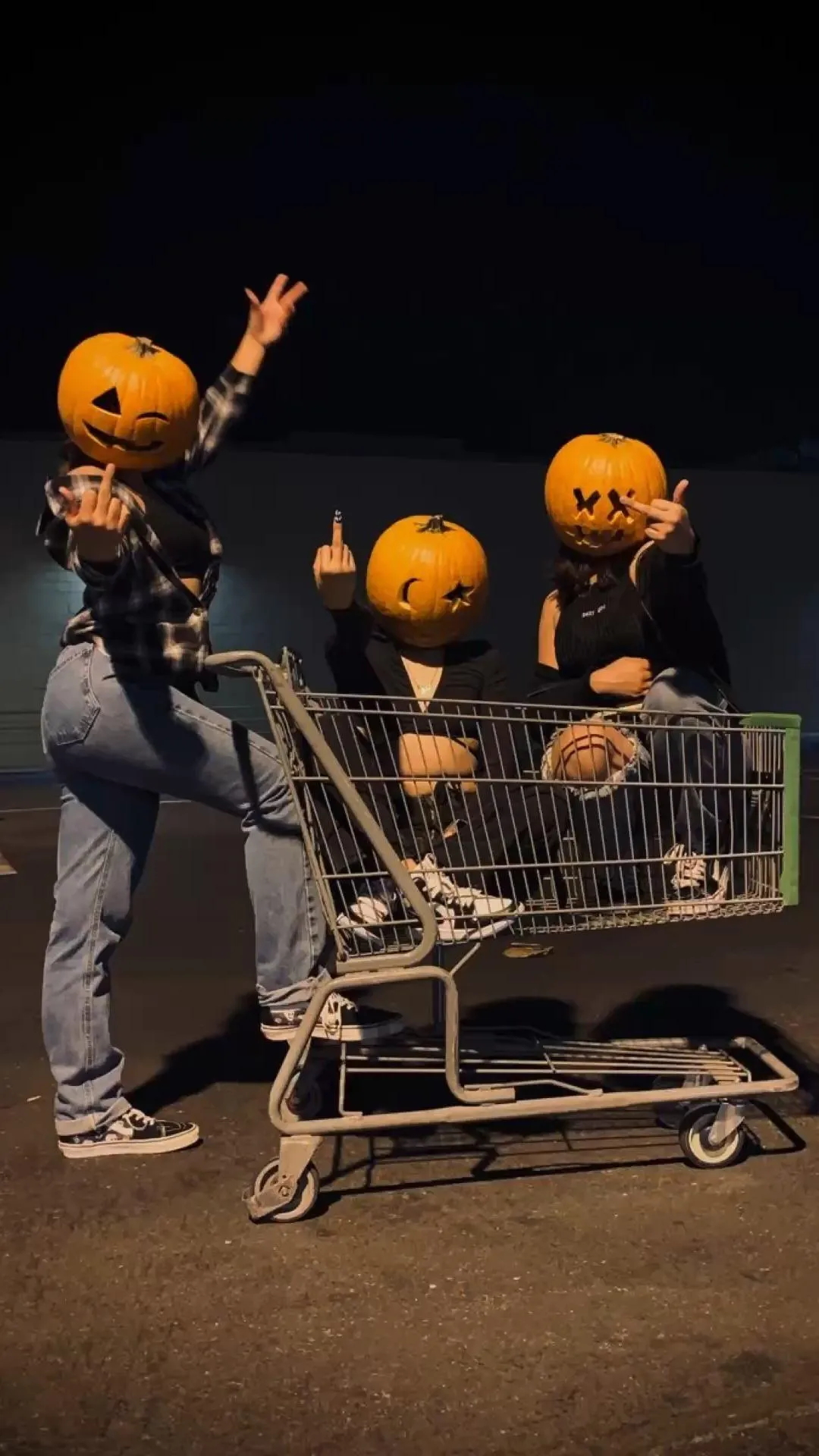 Family Nighttime Halloween Fun with Pumpkin in Cart