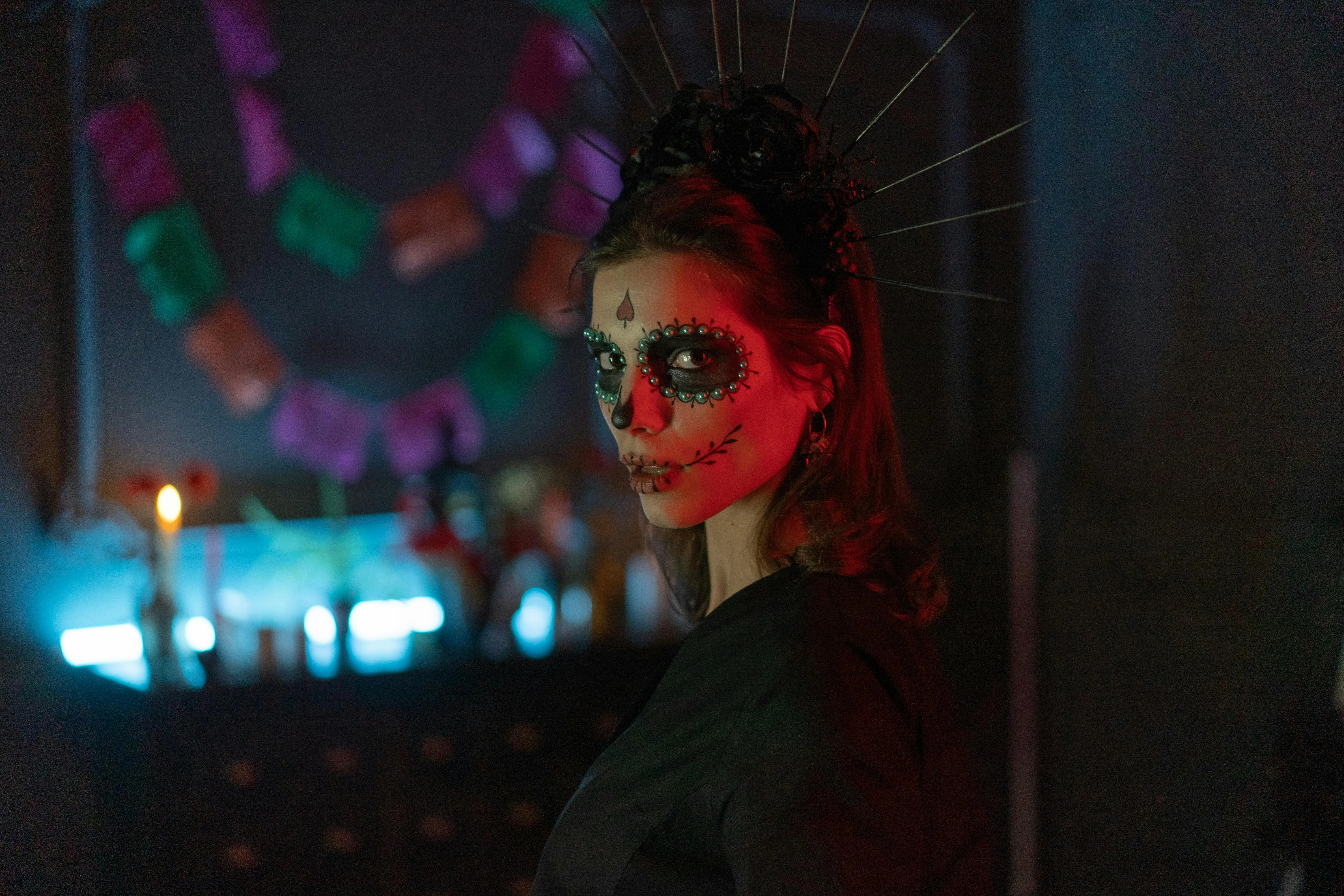 Festival Attendee with Skull Face Paint at Event Wallpaper