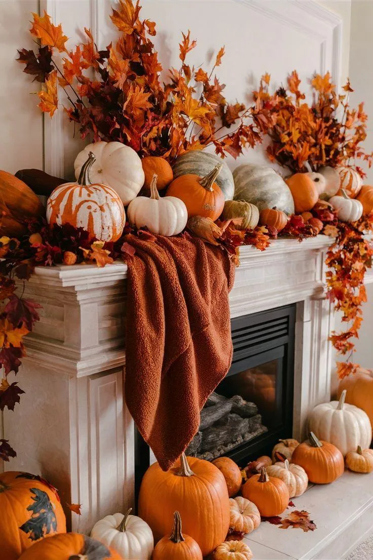 Festive Fireplace Mantle with Pumpkins and Autumn Leaves