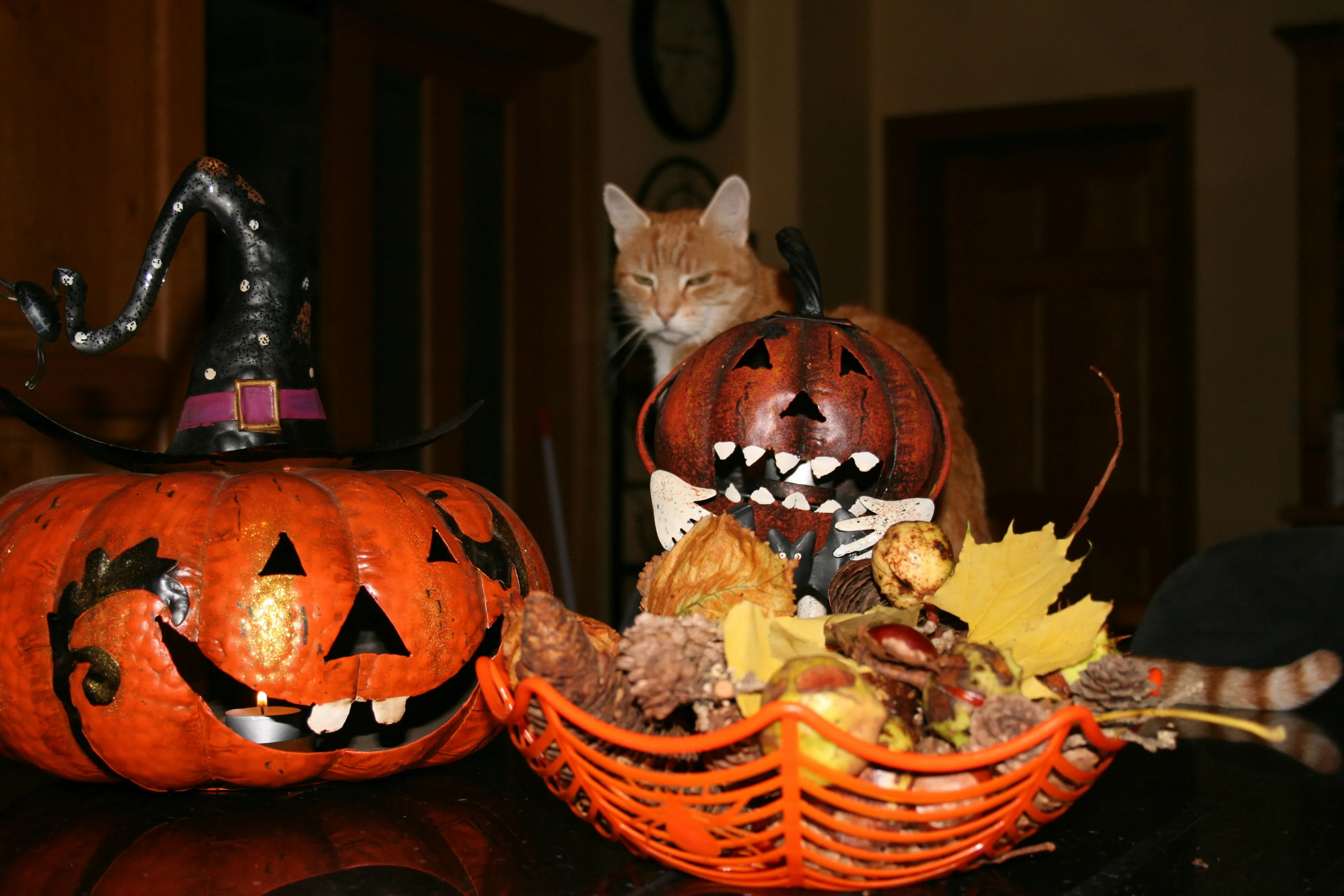 Festive Pumpkin Decor with Leaves and Halloween Items