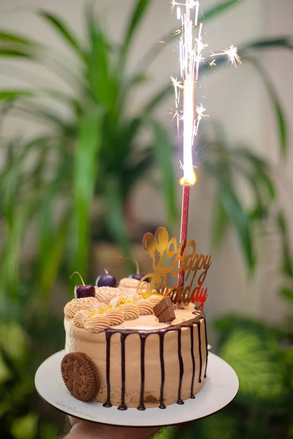Firework Sparkler over a Cake with Candles Wallpaper