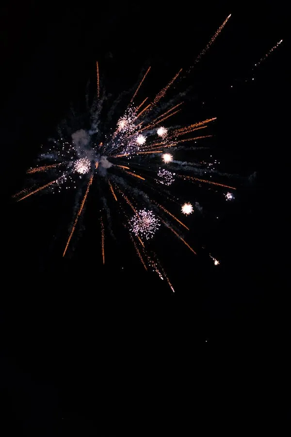 Firework Sparks Creating Trails of Light in the Night Sky