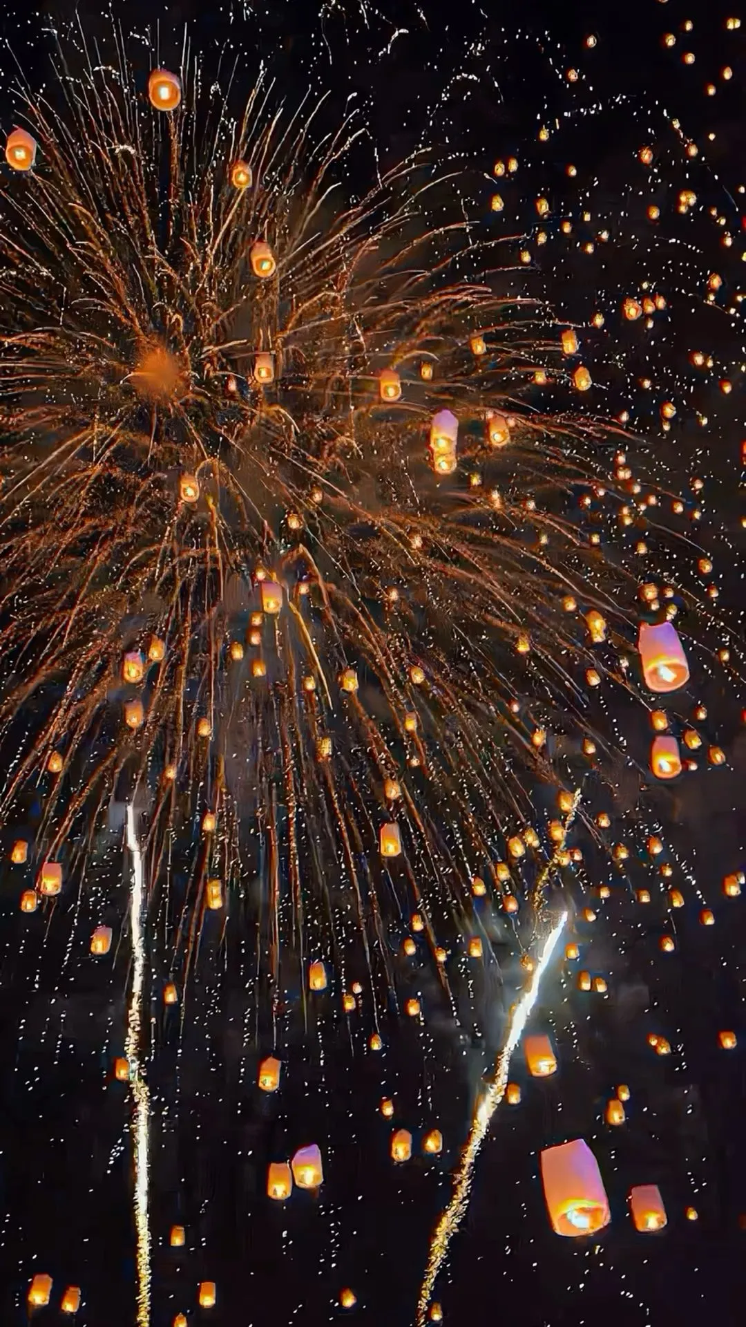 Fireworks and Lanterns Illuminating the Night Sky Wallpaper