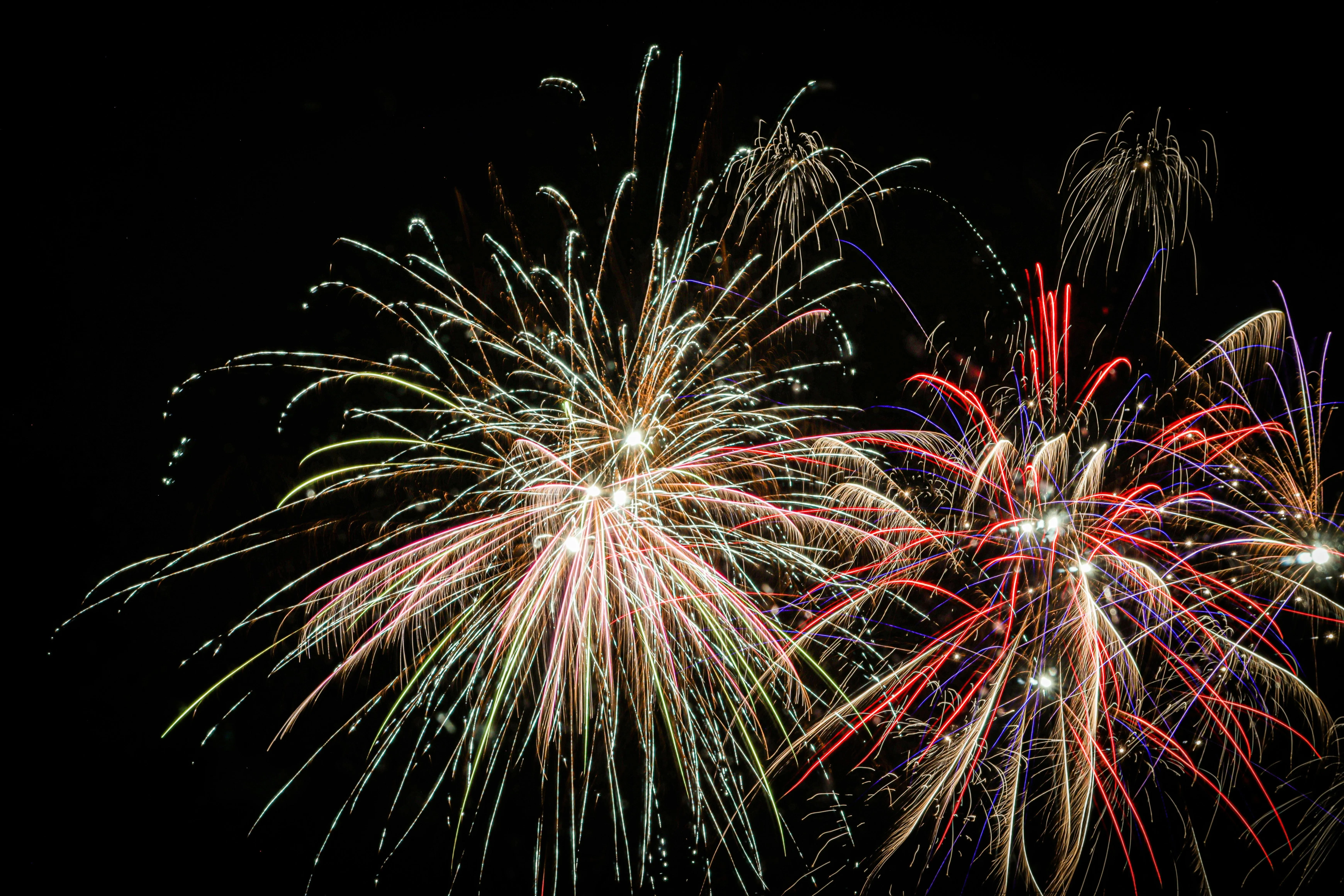 Fireworks and Lights Creating Patterns in the Dark Sky