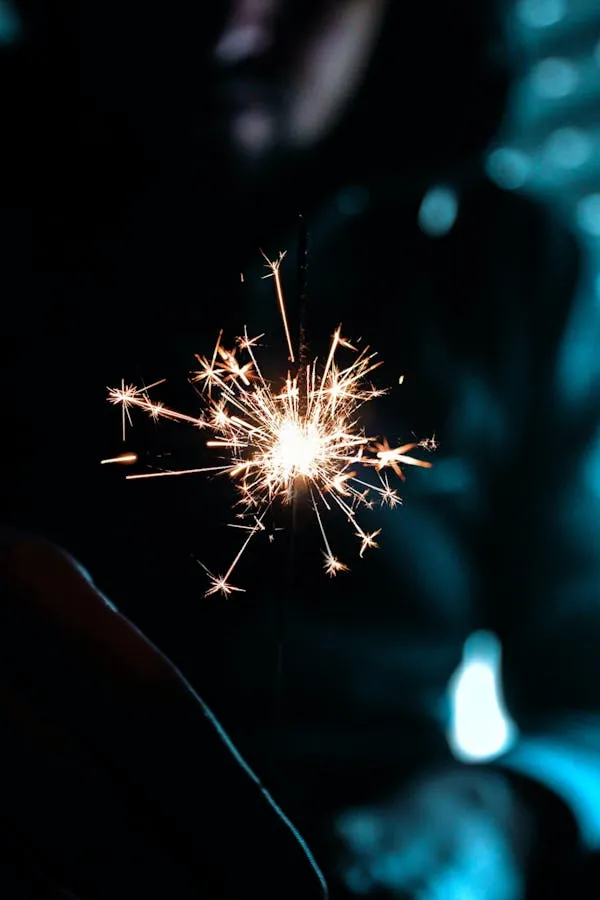 Fireworks Burst with White Red and Blue Trails in Dark Sky