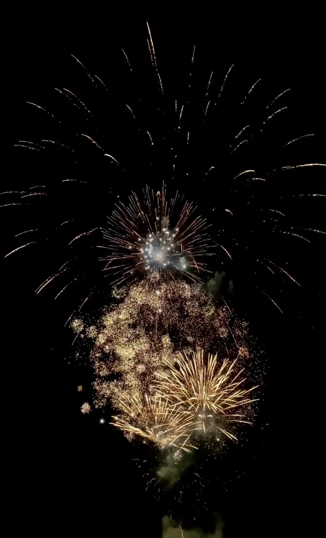 Fireworks bursting in the night sky with bright colors