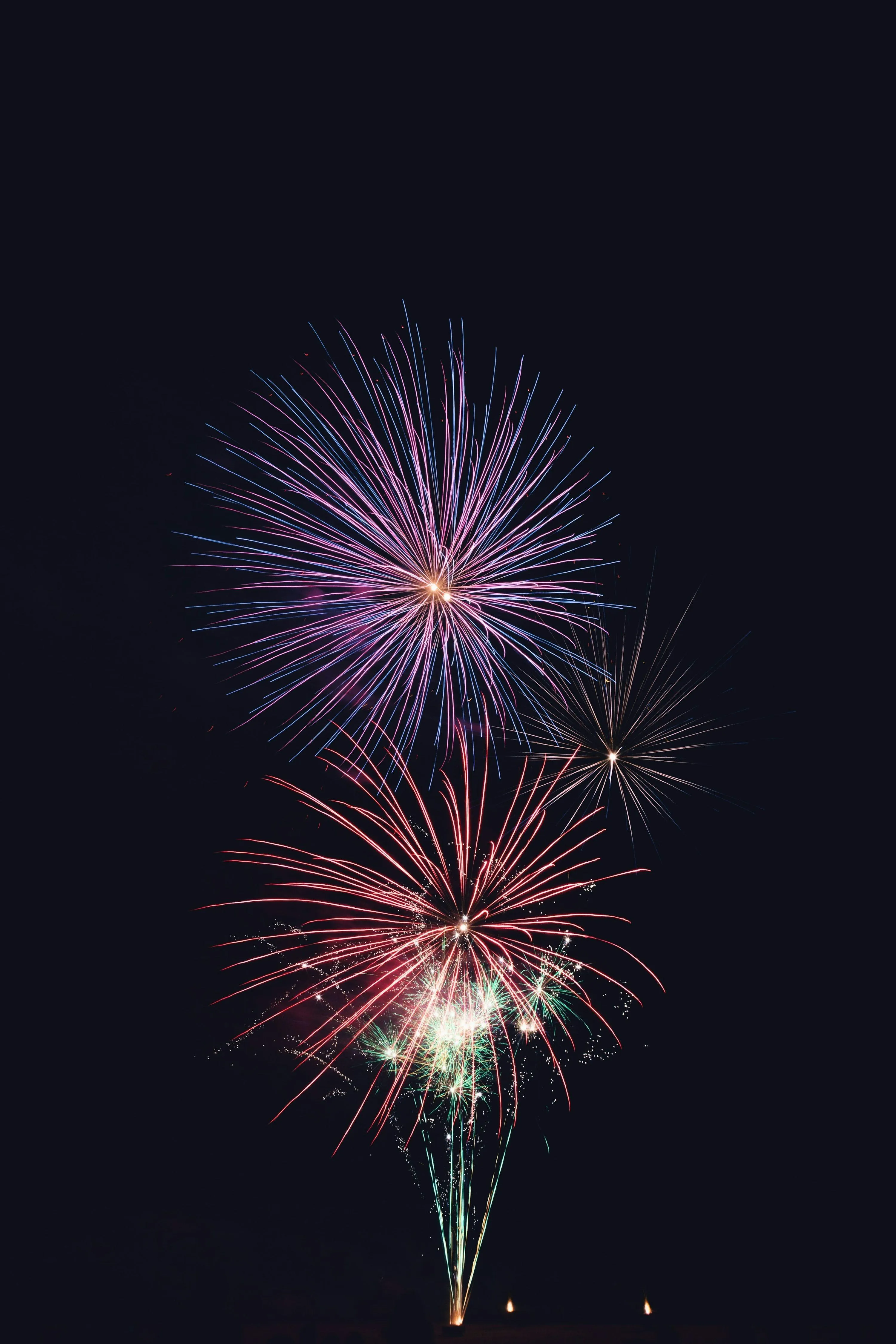 Fireworks display lighting up the night sky with colors