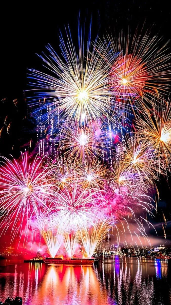 Fireworks display with pink and blue colors lighting HD