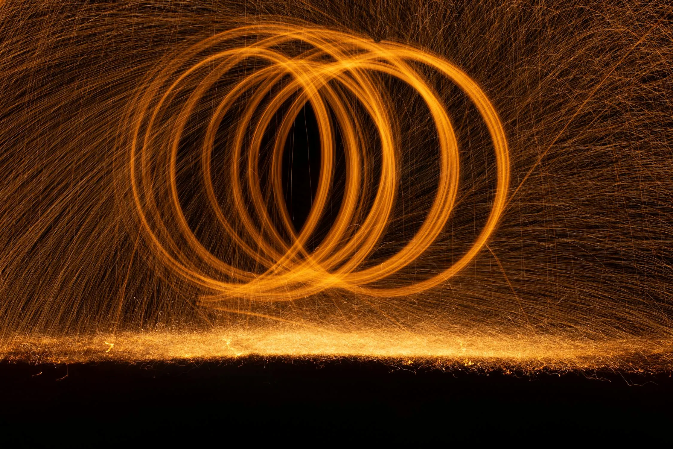 Fireworks Trail Creating Ring Shapes on the Night Sky