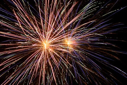 Fireworks with Bright Streaks and Colorful Trails Wallpaper