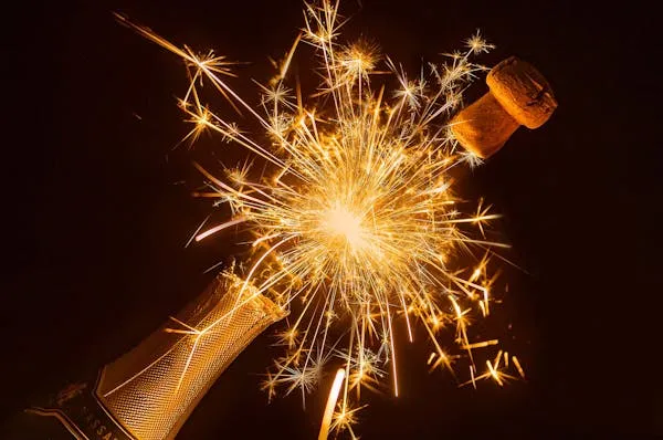 Fireworks with Unique Orange and Yellow Glow Bursting in sky