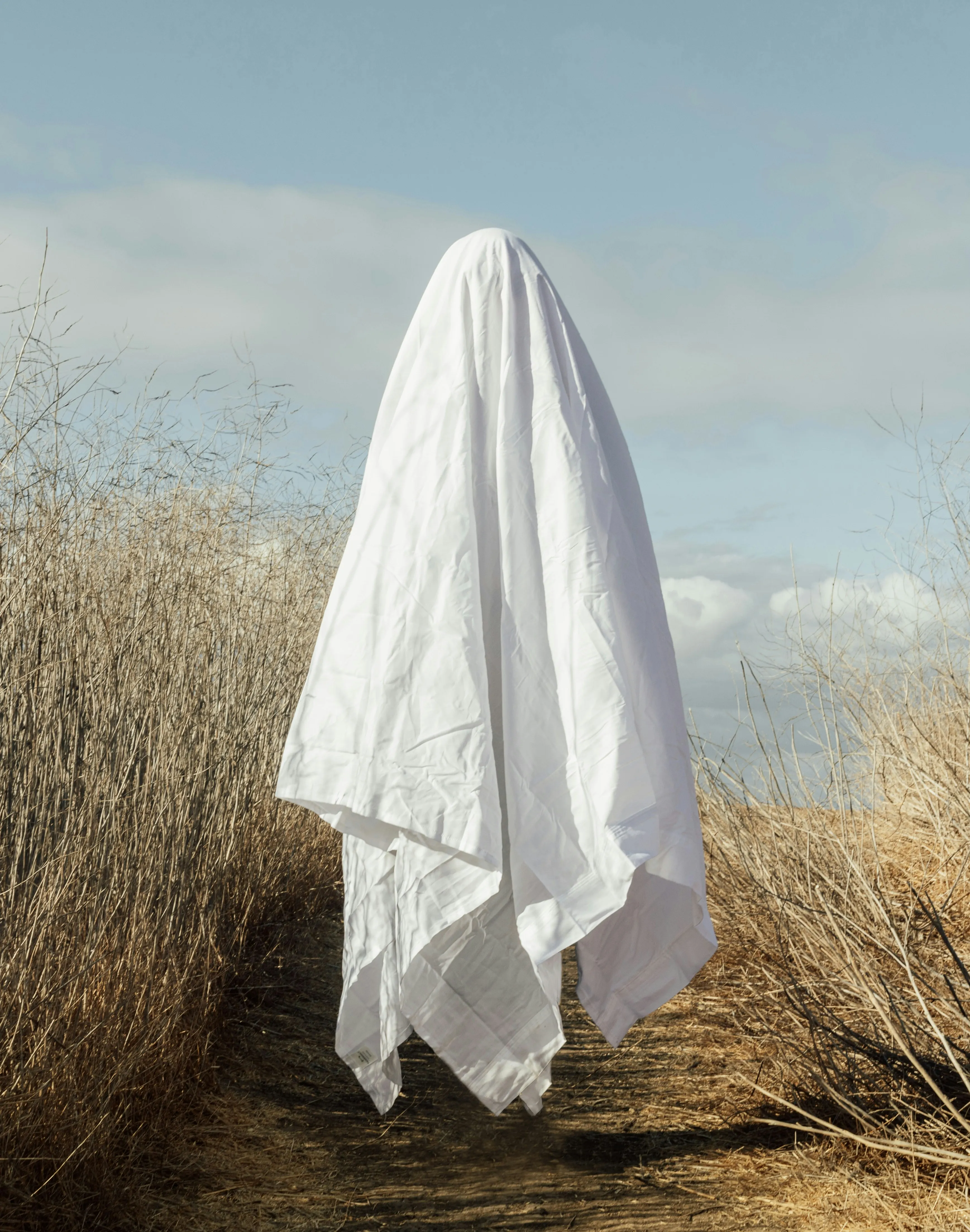Floating Ghost Sheet Figure in Open Field HD Wallpaper