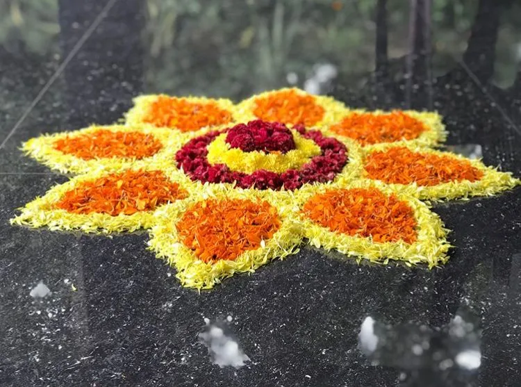 Floral Athappokolam design with orange petal design image