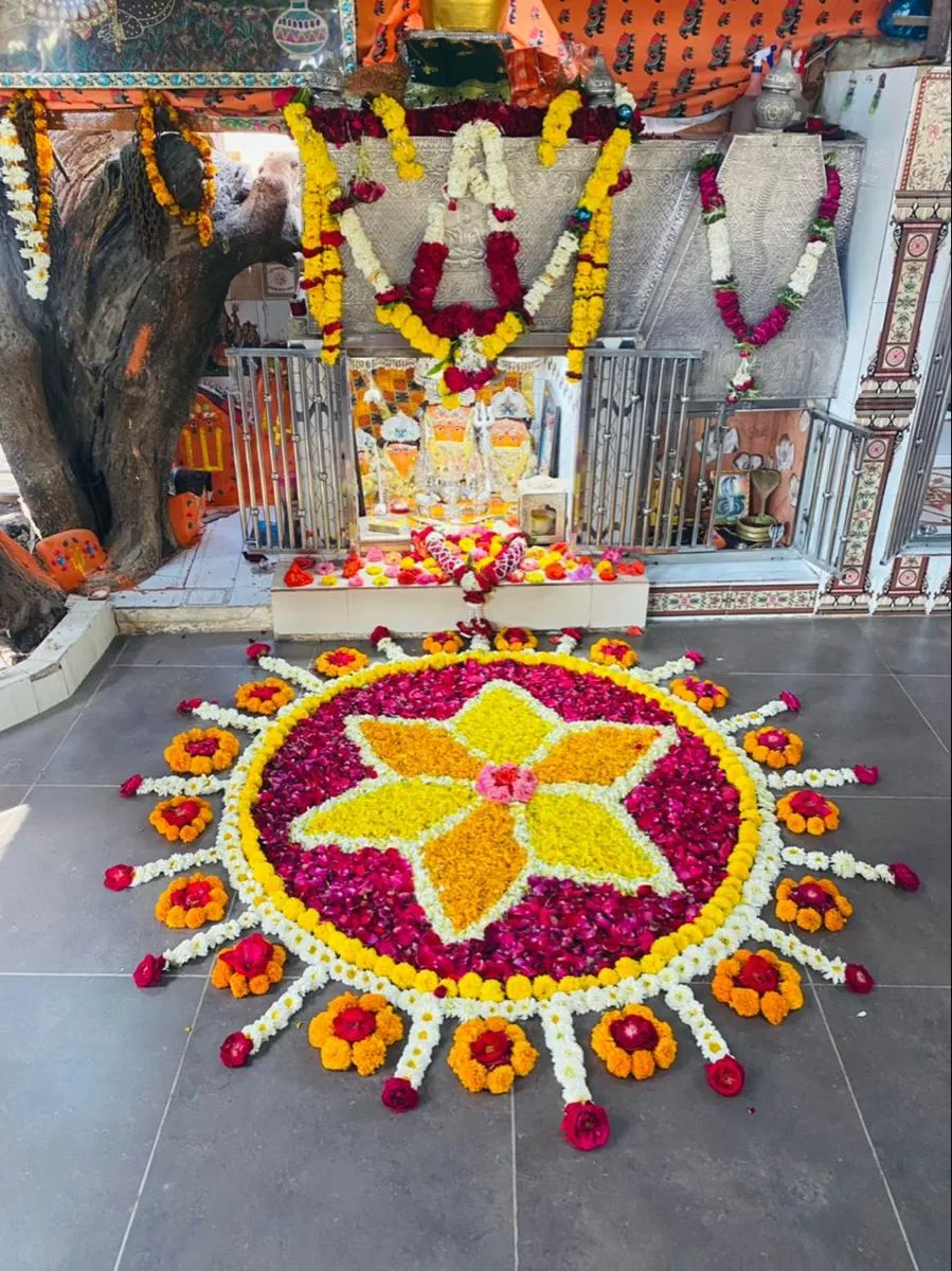 Floral Kolam design for temple with rose and marigold
