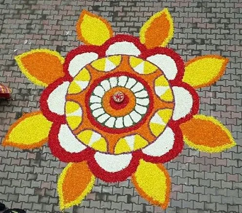 Floral pattern Athapookolam with yellow orange and white