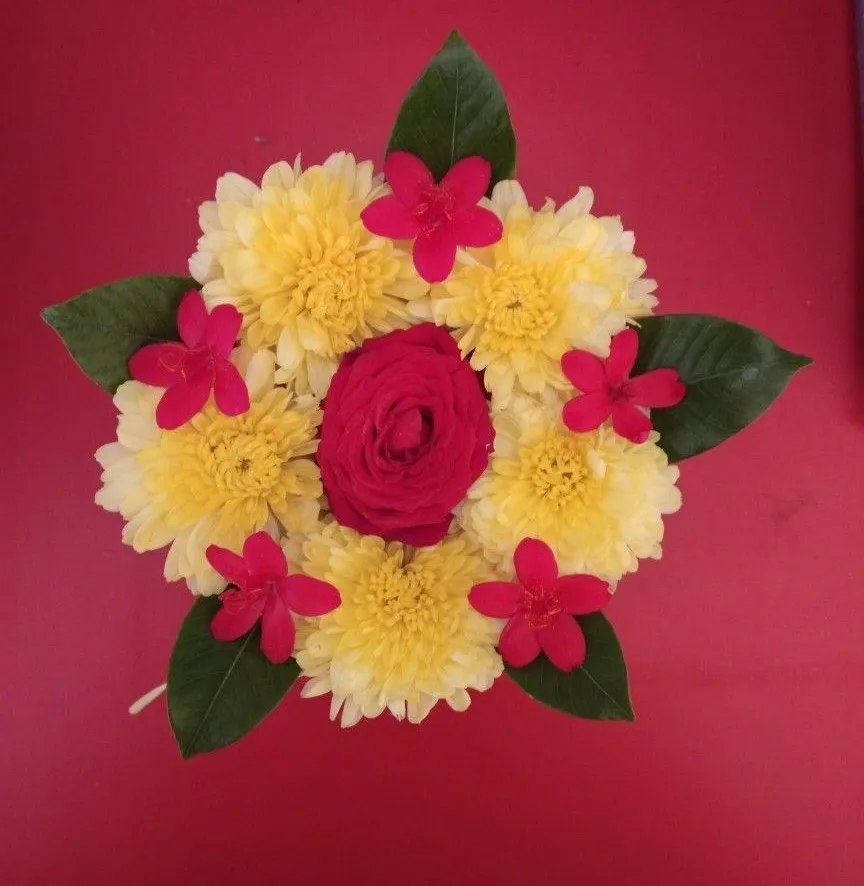 Floral Pookolam Design with Red and Yellow Flowers HD image