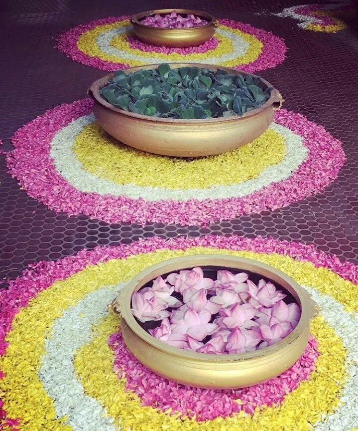 Flower kolam with bowls and petals in concentric circles