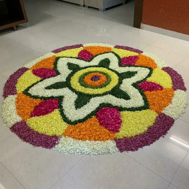 Flower shape Pookolam design with Multicoloured petals image