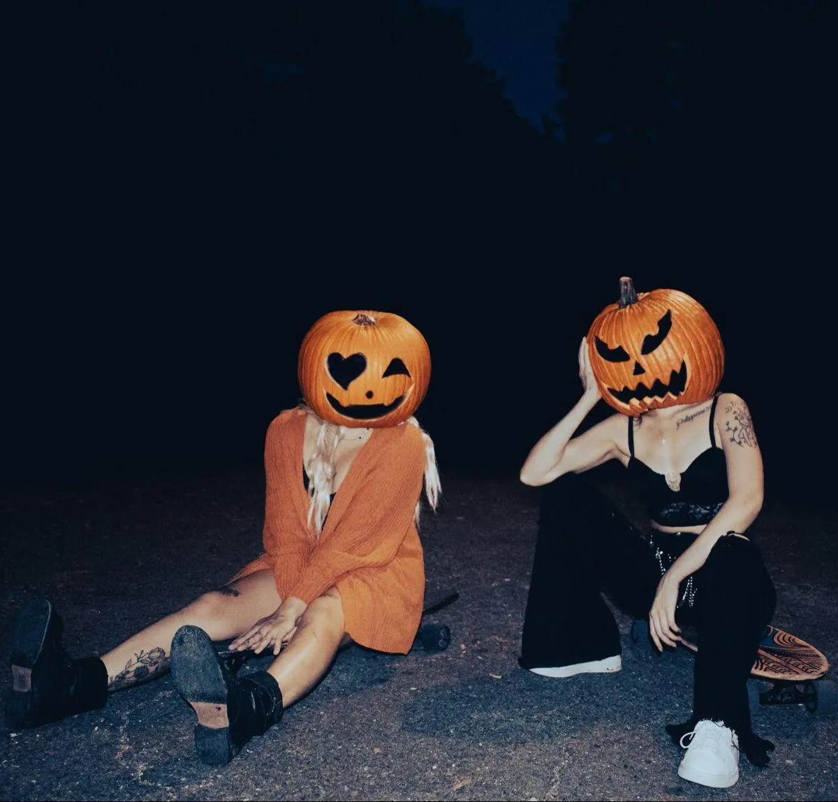 Friends in Playful Pumpkin Head Costumes at Halloween Festival