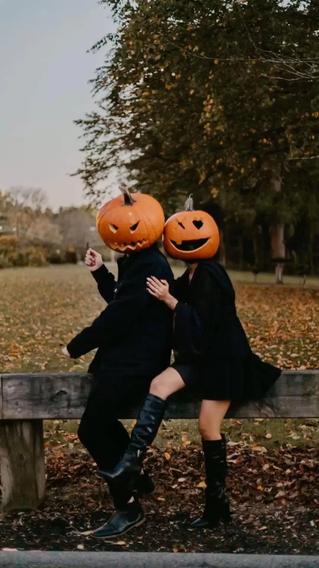 Friends Wearing Pumpkin Head Costumes Outdoor Halloween