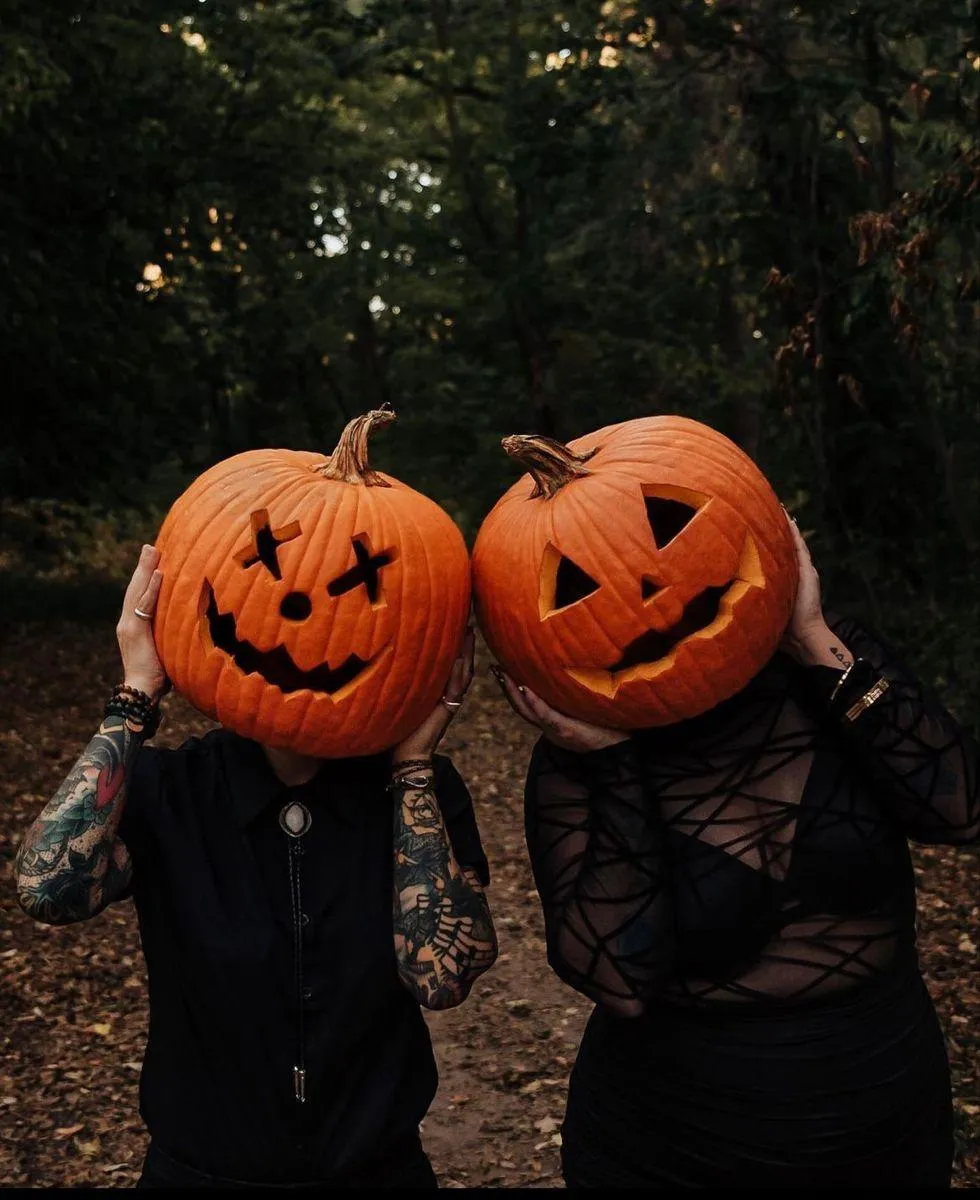 Friends with Matching Pumpkin Head Costumes Outdoors
