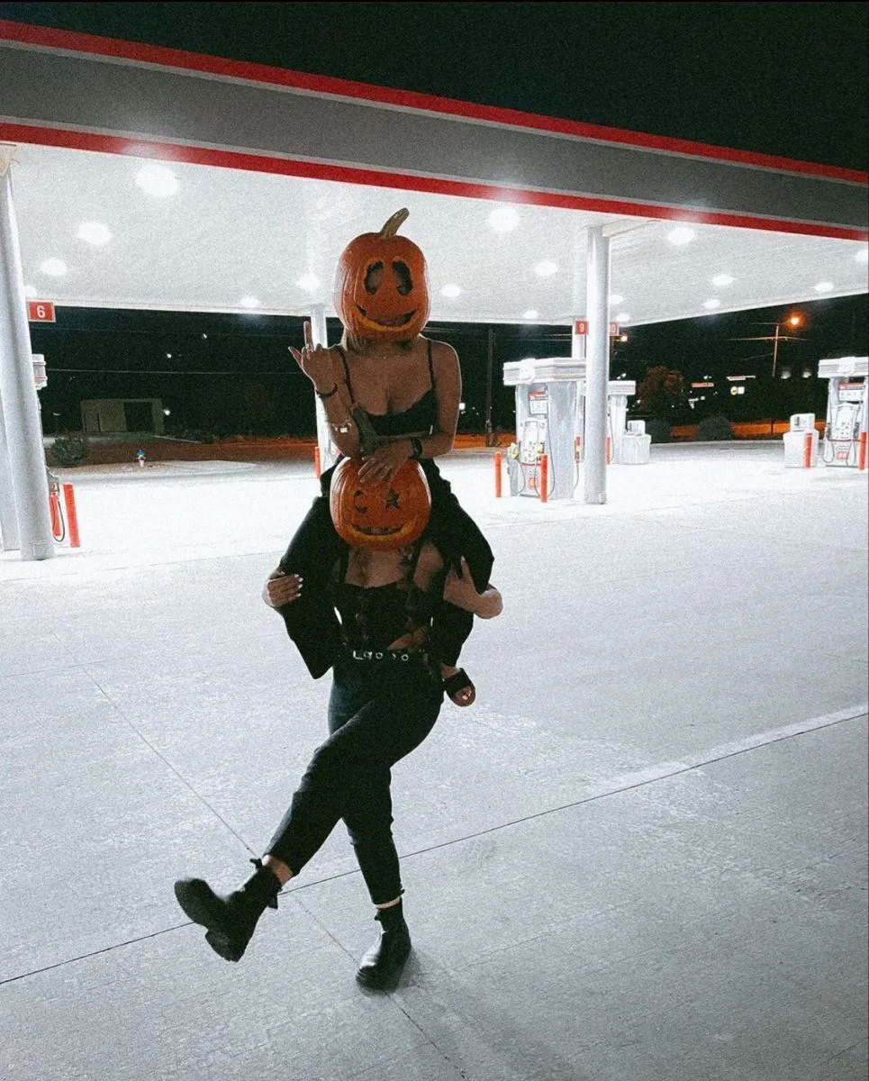 Fun Halloween Festival Moment with Pumpkin Head Costumes
